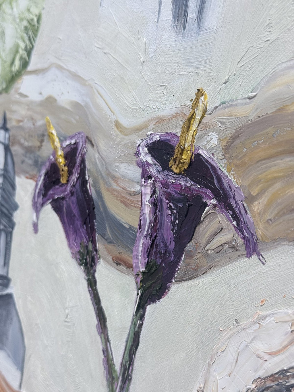 Close-up of the purple calla lilies with gold palette-knife centres